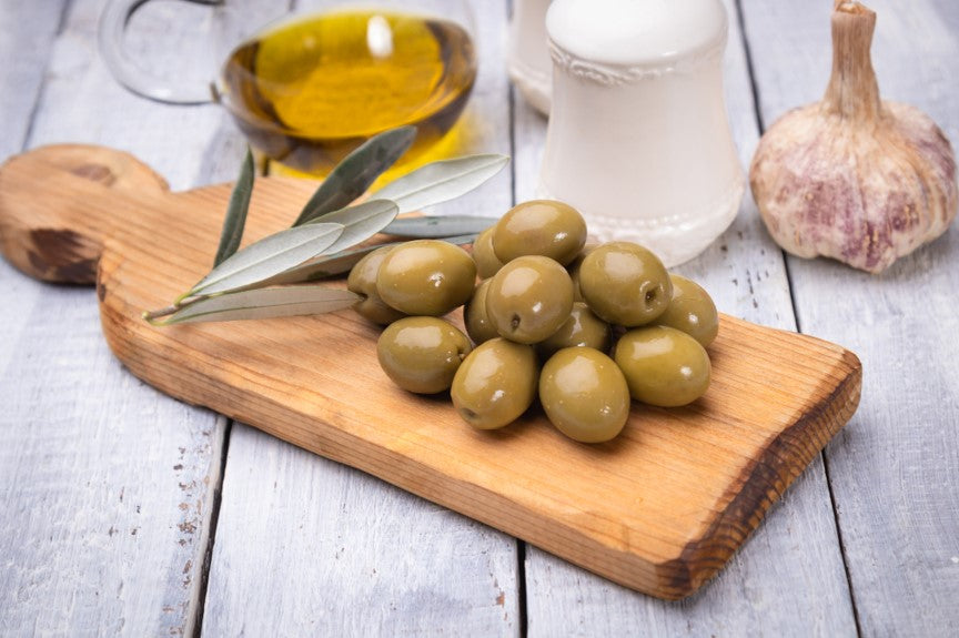 Olives on wood platter